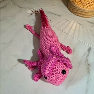 handmade, pink crocheted axolotl plushie w/ fringe tail. 11 in. length